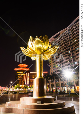 Night view of the large sculpture (Lotus Flower In Full Bloom) at Lotus Square in Macau, China. Night view of the large sculpture (Lotus Flower In Full Bloom) at Lotus Square in Macau, China. 135976855