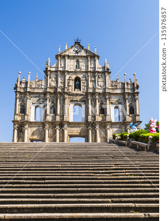 The ruins of St. Paul's Cathedral at Jesus Company Square in Macau, China, are a historic architectural landmark and a UNESCO World Heritage. The ruins of St. Paul's Cathedral at Jesus Company Square in Macau, China, are a historic architectural landmark and a UNESCO World Heritage. 135976857