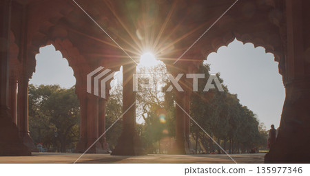 Red sandstone arches of Red Fort with intricate stone details and architectural ornamentation 135977346
