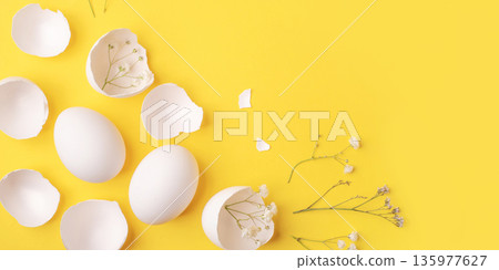 White Easter eggs and shells on a bright yellow background. White Easter eggs and shells on a bright yellow background. 135977627