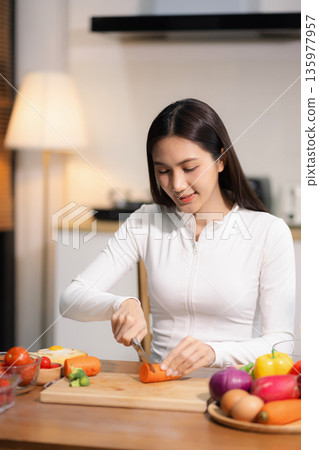 Fit woman enjoys healthy fruit breakfast after yoga training. fitness, nutrition, home lifestyle. Fit woman enjoys healthy fruit breakfast after yoga training. fitness, nutrition, home lifestyle. 135977957