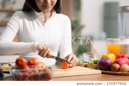 Fit woman enjoys healthy fruit breakfast after yoga training. fitness, nutrition, home lifestyle. Fit woman enjoys healthy fruit breakfast after yoga training. fitness, nutrition, home lifestyle. 135977958
