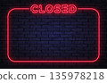 Red neon closed sign with glowing frame on dark brick wall. Bold light clearly shows business shutdown, unavailable service, or end of working hours. 135978218