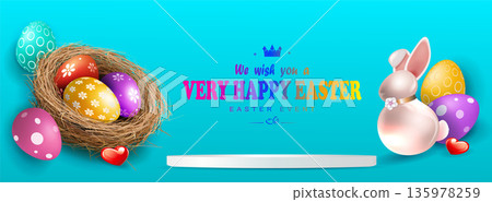 Happy Easter. A festive blue arrangement with a straw nest and a cute bunny holding Easter egg Happy Easter. A festive blue arrangement with a straw nest and a cute bunny holding Easter egg 135978259