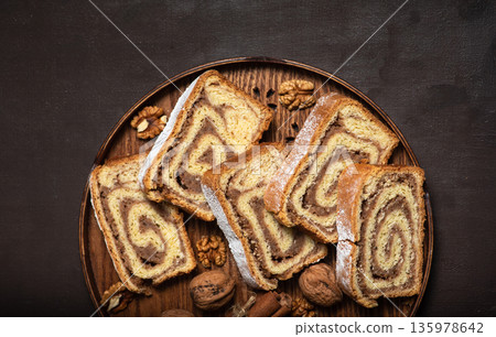 Sliced of walnut roll Sliced of walnut roll 135978642