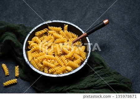 Uncooked Fusilli pasta Uncooked Fusilli pasta 135978671