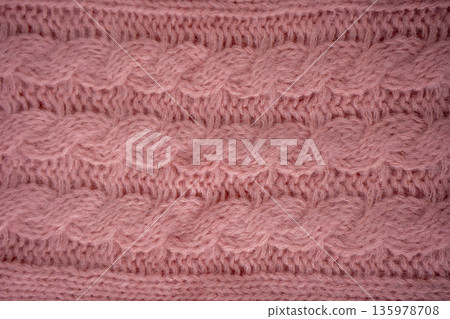 Pink Cable Knit Fabric woolen sweater background Pink Cable Knit Fabric woolen sweater background 135978708