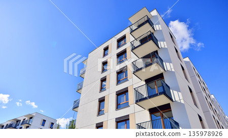 Luxury house complex of flats in condo area. Part of city real estate property, condo architecture on a sunny day no people. Luxury house complex of flats in condo area. Part of city real estate property, condo architecture on a sunny day no people. 135978926