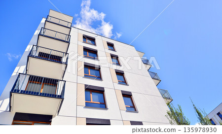 Luxury house complex of flats in condo area. Part of city real estate property, condo architecture on a sunny day no people. 135978930