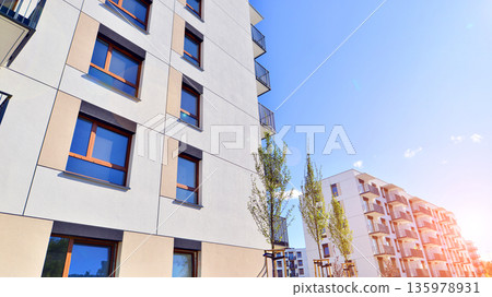 Luxury house complex of flats in condo area. Part of city real estate property, condo architecture on a sunny day no people. 135978931