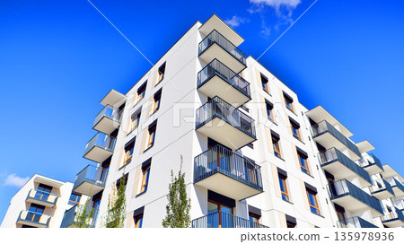 Luxury house complex of flats in condo area. Part of city real estate property, condo architecture on a sunny day no people. 135978936