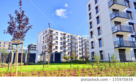 Luxury house complex of flats in condo area. Part of city real estate property, condo architecture on a sunny day no people. Luxury house complex of flats in condo area. Part of city real estate property, condo architecture on a sunny day no people. 135978939