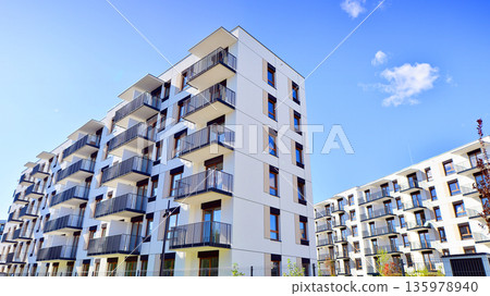 Luxury house complex of flats in condo area. Part of city real estate property, condo architecture on a sunny day no people. Luxury house complex of flats in condo area. Part of city real estate property, condo architecture on a sunny day no people. 135978940