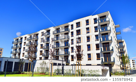 Luxury house complex of flats in condo area. Part of city real estate property, condo architecture on a sunny day no people. Luxury house complex of flats in condo area. Part of city real estate property, condo architecture on a sunny day no people. 135978942