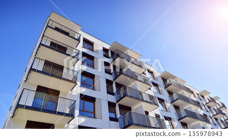 Luxury house complex of flats in condo area. Part of city real estate property, condo architecture on a sunny day no people. Luxury house complex of flats in condo area. Part of city real estate property, condo architecture on a sunny day no people. 135978943