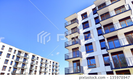 Luxury house complex of flats in condo area. Part of city real estate property, condo architecture on a sunny day no people. 135978947