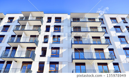 Luxury house complex of flats in condo area. Part of city real estate property, condo architecture on a sunny day no people. 135978949