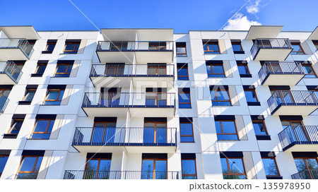 Luxury house complex of flats in condo area. Part of city real estate property, condo architecture on a sunny day no people. 135978950