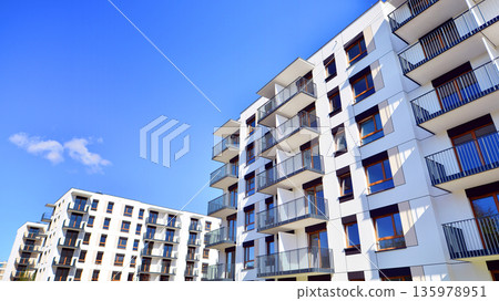 Luxury house complex of flats in condo area. Part of city real estate property, condo architecture on a sunny day no people. 135978951