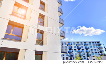Luxury house complex of flats in condo area. Part of city real estate property, condo architecture on a sunny day no people. Luxury house complex of flats in condo area. Part of city real estate property, condo architecture on a sunny day no people. 135978955