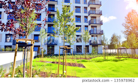 Luxury house complex of flats in condo area. Part of city real estate property, condo architecture on a sunny day no people. 135978962