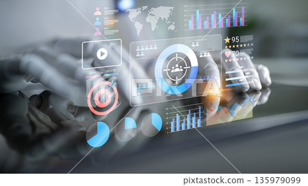 Futuristic Hands Interacting with Digital Analytics Dashboard Displaying Graphs, Charts, Target Icons and Global Maps in a Modern Work Environment Gantry Futuristic Hands Interacting with Digital Analytics Dashboard Displaying Graphs, Charts, Target Icons and Global Maps in a Modern Work Environment Gantry 135979099