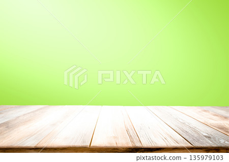Empty wooden table on green background Empty wooden table on green background 135979103