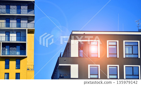 Luxury house complex of flats in condo area. Part of city real estate property, condo architecture on a sunny day no people. Luxury house complex of flats in condo area. Part of city real estate property, condo architecture on a sunny day no people. 135979142