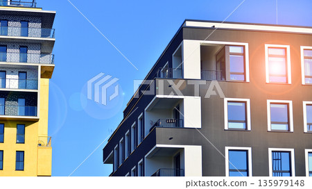Luxury house complex of flats in condo area. Part of city real estate property, condo architecture on a sunny day no people. 135979148