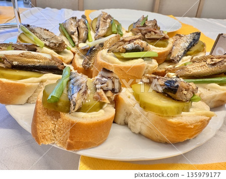juicy fresh sandwiches with sprats and herbs 135979177