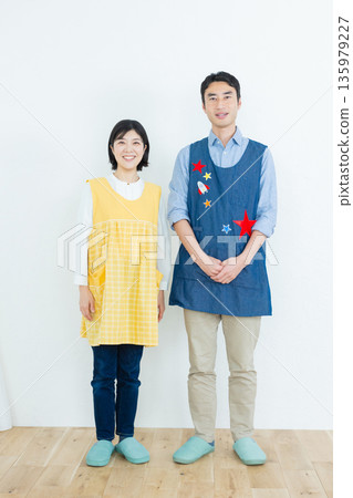 Men and women in aprons 135979227