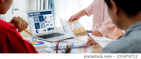 Human resources software on computer screen help employee manage people brisk Human resources software on computer screen help employee manage people brisk 135979712