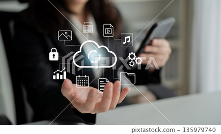 Business Professional Using Smartphone with Digital Cloud Storage Icons Representing Data Management and Technology Solutions for Modern Work Environments Gantry Business Professional Using Smartphone with Digital Cloud Storage Icons Representing Data Management and Technology Solutions for Modern Work Environments Gantry 135979740