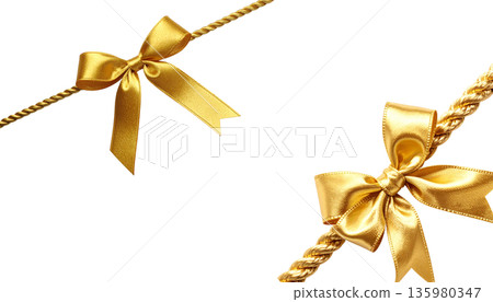 A shimmering gold ribbon is tied in a bow and placed against a white background. A shimmering gold ribbon is tied in a bow and placed against a white background. 135980347