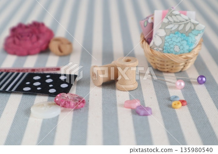 Sewing image with small buttons and pins 135980540