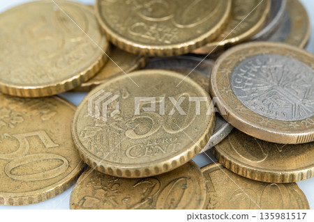 pile of coins. Collection of euro coins in various denominations showing value and details of the currency pile of coins. Collection of euro coins in various denominations showing value and details of the currency 135981517