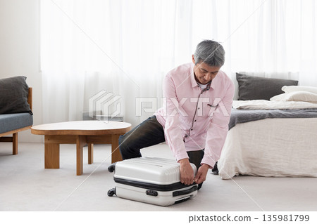 A man preparing for a business trip 135981799