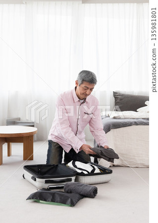 A man preparing for a business trip 135981801