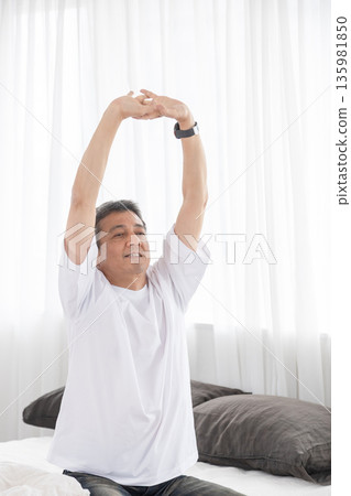 A man stretching A man stretching 135981850
