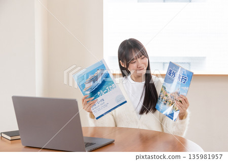 Women planning for a trip Women planning for a trip 135981957