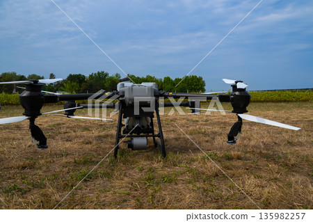 Drone in field ready for agricultural surveillance and aerial inspection operations 135982257