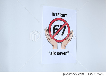 Sign on the white wall prohibition meme phrase six seven in French 135982526