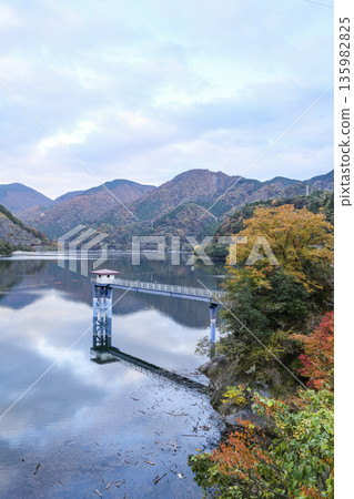 Lake Tanzawa and the water intake tower as the leaves turn red Lake Tanzawa and the water intake tower as the leaves turn red 135982825