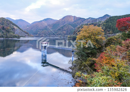 Lake Tanzawa and the water intake tower as the leaves turn red Lake Tanzawa and the water intake tower as the leaves turn red 135982826