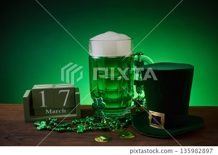 St. Patrick's day celebration with green beer and leprechaun hat St. Patrick's day celebration with green beer and leprechaun hat 135982897