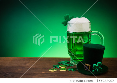 Green beer, shamrock decorating st. Patrick's day celebration Green beer, shamrock decorating st. Patrick's day celebration 135982902