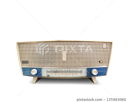 An antique cream and blue radio sits on a white floor. 135983060