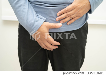 Hernia, Asian man stomach ache, abdominal pain and urology problem health. Hernia, Asian man stomach ache, abdominal pain and urology problem health. 135983605