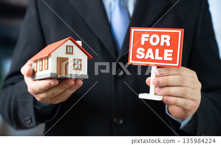 Listing a house for sale. A realtor helps sell the house. Residential property transaction, market valuation and negotiation support. Real estate services 135984224
