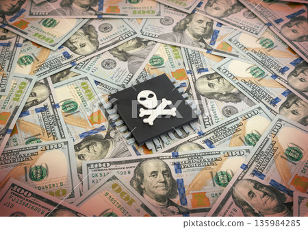 Microchip with a skull on a background of dollar bills. The sharp rise in the price of computer components is harming the industry. Semiconductor crisis concept, cost inflation and supply chain stress Microchip with a skull on a background of dollar bills. The sharp rise in the price of computer components is harming the industry. Semiconductor crisis concept, cost inflation and supply chain stress 135984285